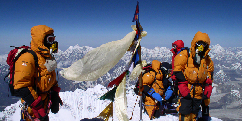 Sherpas on the summit of Mount Everest.